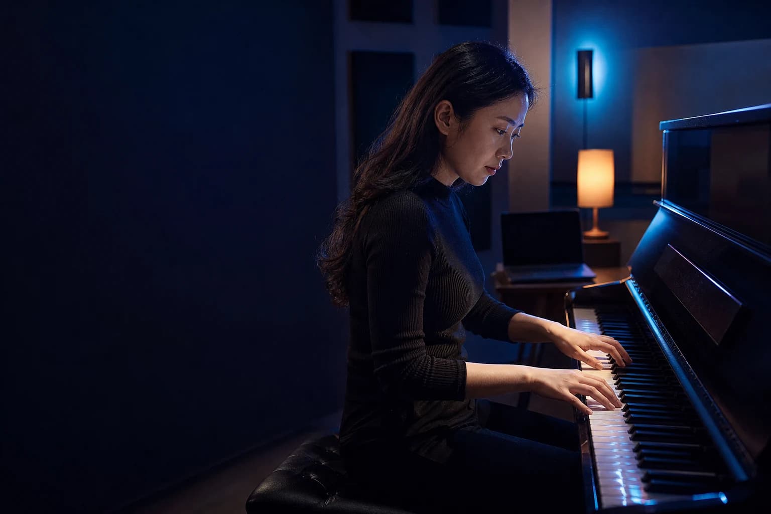 A pianist concentrating during a private evening practice session